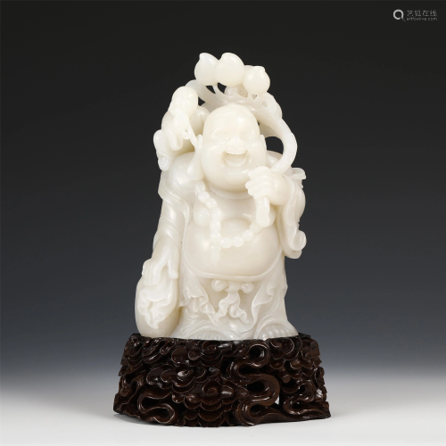 A CHINESE JADE CARVED STATUETTE OF BUDDHA