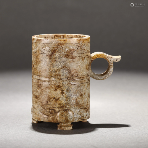 A CHINESE CARVED JADE TRIPOD CUP