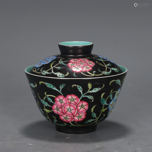 A CHINESE BLACK-GROUND FAMILLE ROSE BOWL AND COVER
