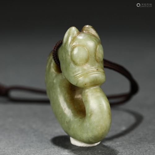 A CHINESE CARVED BEAST PENDANT