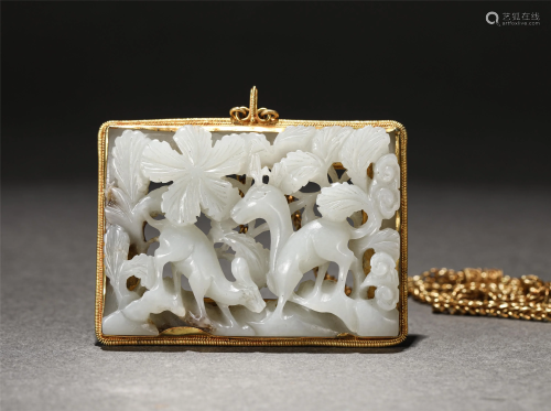 A CHINESE GILDING MOUNTED JADE PENDANT