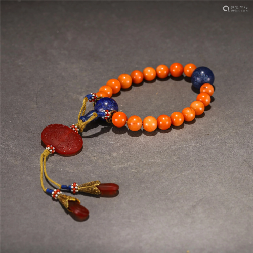 A STRING OF CHINESE CORAL PRAYER BEADS