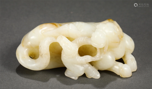 A CHINESE JADE CARVING OF FIGURE AND ANIMAL