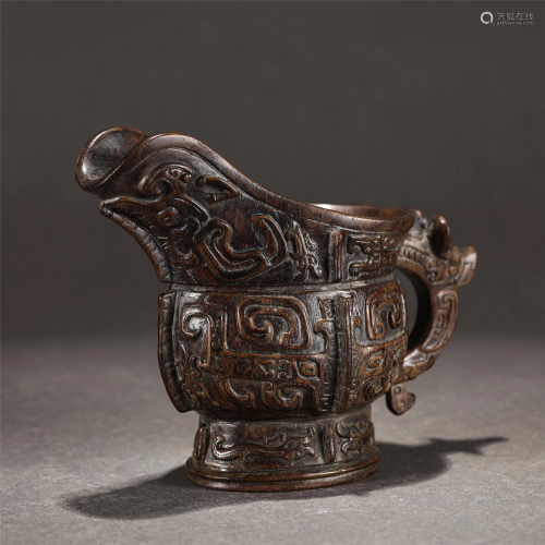 A CHINESE CARVED CHENXIANG WOOD JUE CUP