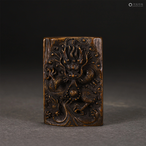 A CHINESE CHENXIANG WOOD CARVED DRAGON PENDANT
