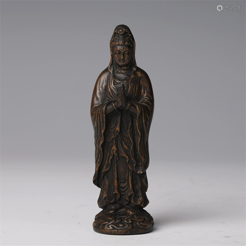 A CHINESE CHENXIANG WOOD CARVED STATUETTE OF GUA…