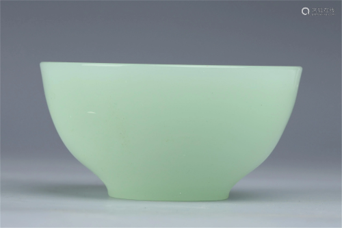 A CHINESE GREEN GLASS BOWL