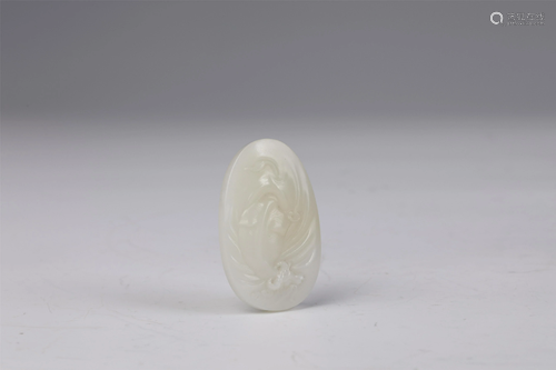 A CHINESE JADE CARVED BUFFALO PENDANT