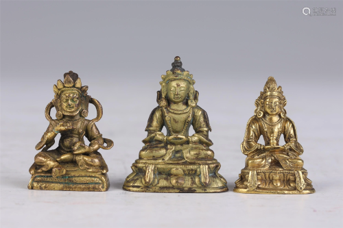 A GROUP OF THREE CHINESE BRONZE STATUETTES OF BUDDHAS