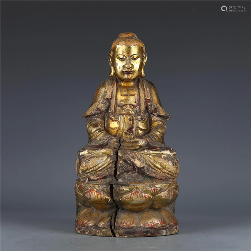 A CHINESE GOLD PAINTED WOODEN FIGURINE OF SHAKYAMUNI