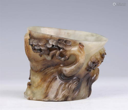 A CHINESE JADE CARVED FIGURE AND PINE BRUSH POT
