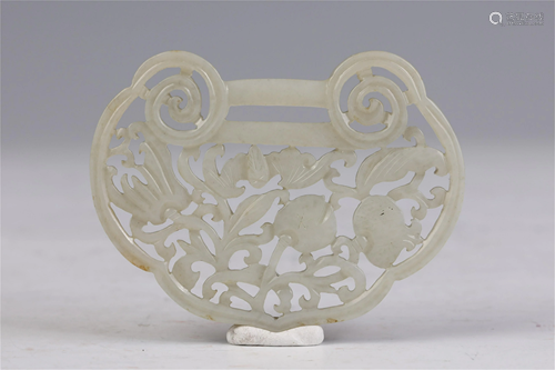 A CHINESE HOLLOW CARVED RUYI SHAPED JADE PENDANT