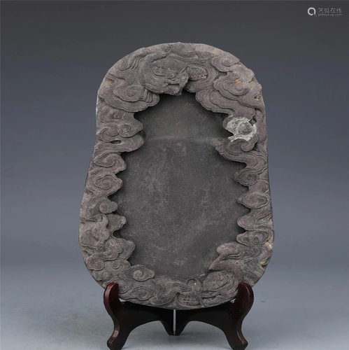 A CHINESE PURPLE DUAN CARVED DRAGON INK-STONE