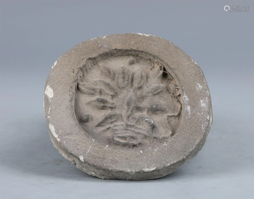 A CHINESE GRAY POTTERY CIRCULAR TILE