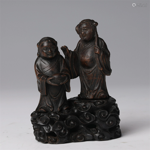 A CHINESE CHENXIANG WOOD CARVED STATUETTE OF BUD…