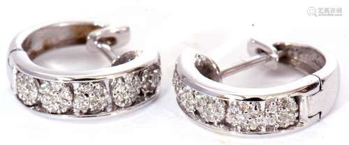 Pair of modern precious metal small diamond set hoop earring...