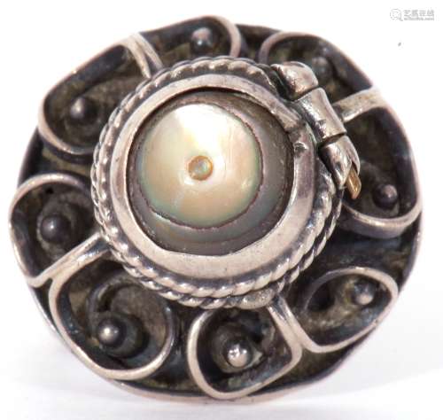 White metal filigree poison ring, the hinged mother of pearl...