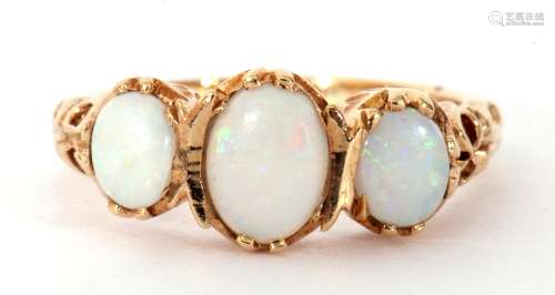 Modern 9ct gold opal ring featuring three graduated oval cab...