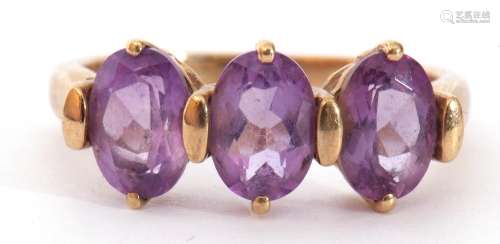 Modern 9ct gold amethyst ring, a design with three oval cush...