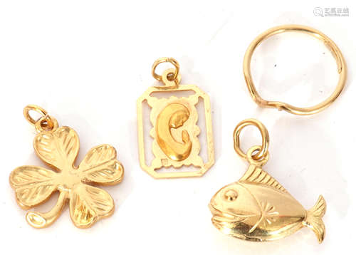 Three yellow metal charms, a fish, a clover leaf and a frame...