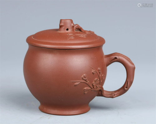 A CHINESE YIXING CLAY INCISED PLUM BLOSSOM CUP AND