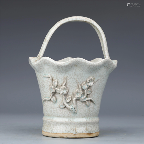 A CHINESE CELADON GLAZED FLOWER POT WITH LOOP HANDLE