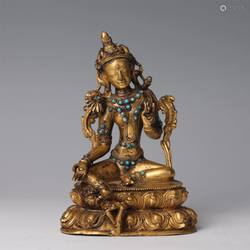 A CHINESE TURQUOISE INLAID GILT BRONZE STATUETTE OF