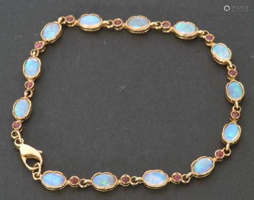 Modern 9ct gold opal and small ruby bracelet featuring 13 ov...