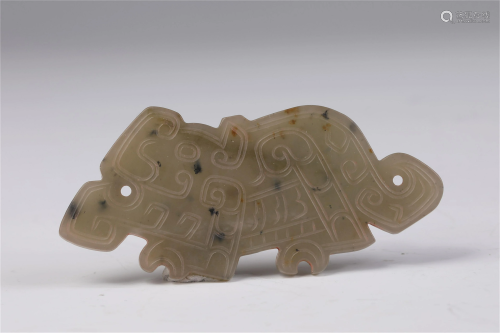 A CHINESE JADE CARVED AUSPICIOUS BEAST PENDANT