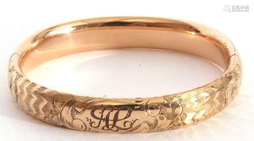 Gold plated hinged bracelet, part chased and engraved, insid...