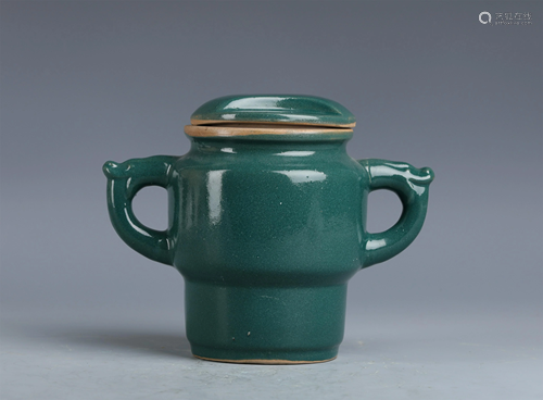 A CHINESE PINE GREEN GLAZED DRAGON HANDLED JAR