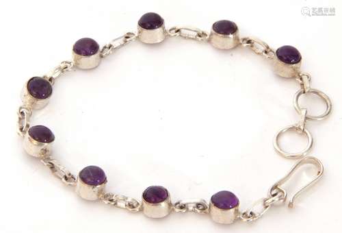 White metal and amethyst bracelet featuring nine cabochon am...