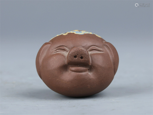 A CHINESE POLYCHROME SHOU CHARACTER YIXING CLAY PIG