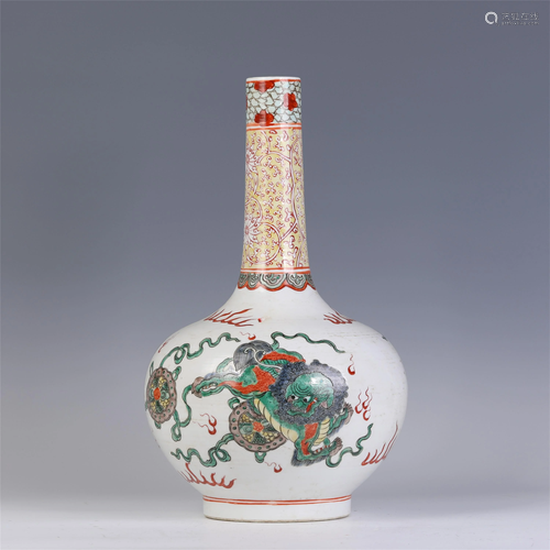 A CHINESE FAMILLE ROSE LION AND SILK BALL PORCELAIN