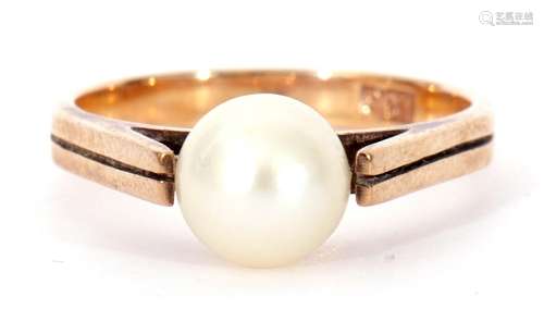 9ct stamped and cultured pearl ring, a single full pearl rai...