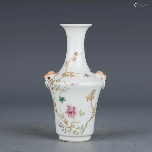 A CHINESE FAMILLE ROSE DOUBLE HANDLED PORCELAIN VASE