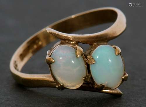 9ct gold and opal cross-over ring featuring two oval cabocho...