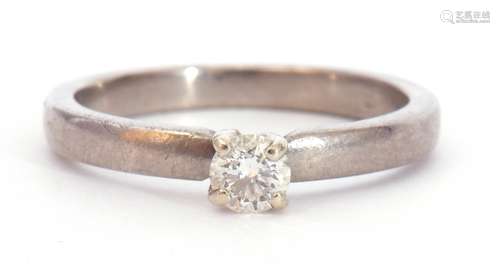 Precious metal single stone diamond ring featuring a round b...