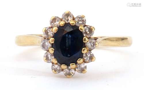 18ct gold sapphire and diamond cluster ring, the oval shaped...