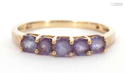 Modern 9K stamped ring set with five purple coloured stones,...