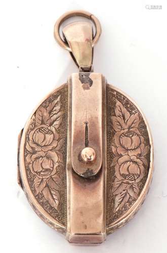 Victorian gold locket, of oval hinged design, chased and eng...