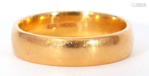 High grade yellow metal wedding ring of plain polished desig...