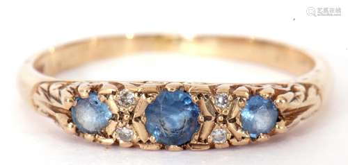 Sapphire and diamond ring featuring three round cut graduate...