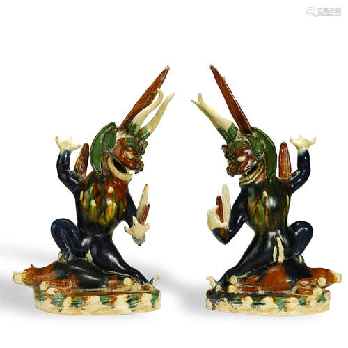 TANG DYNASTY,A PAIR OF SANCAI-GLAZED POTTERY MYTHICAL BEASTS