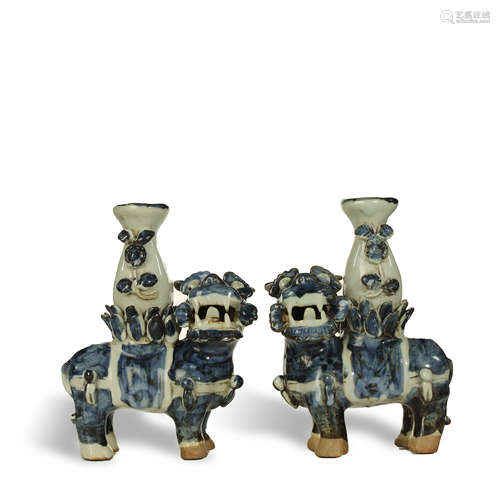 MING DYNASTY,A PAIR OF BLUE AND WHITE GLAZED CANDLESTICKS