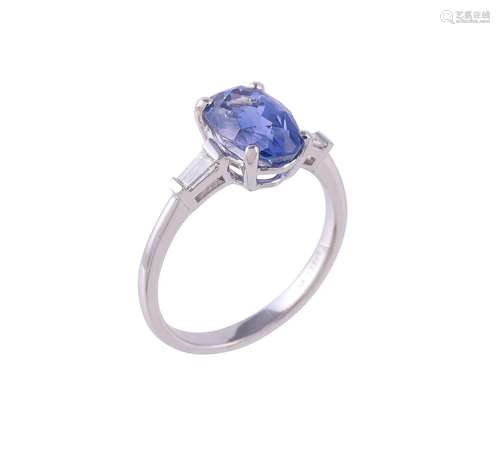 A sapphire and diamond three stone ring