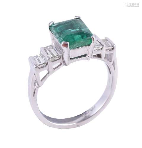 An emerald and diamond five stone ring