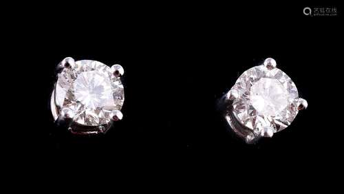 A pair of diamond stud earrings