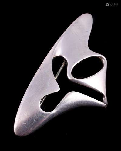 A silver coloured abstract brooch designed by Henning Koppel...