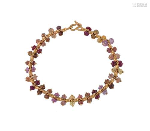 A gold coloured beaded bracelet